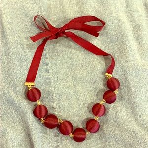 Plum bauble necklace on grosgrain ribbon
